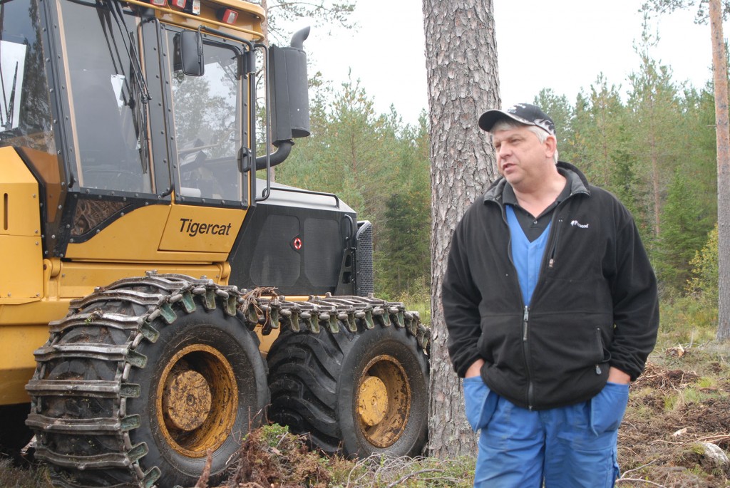Tommy Olers, foreman for Akers Skog stands in front of one of their forwarders. 