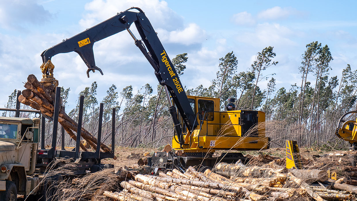 250E loader working in the field.