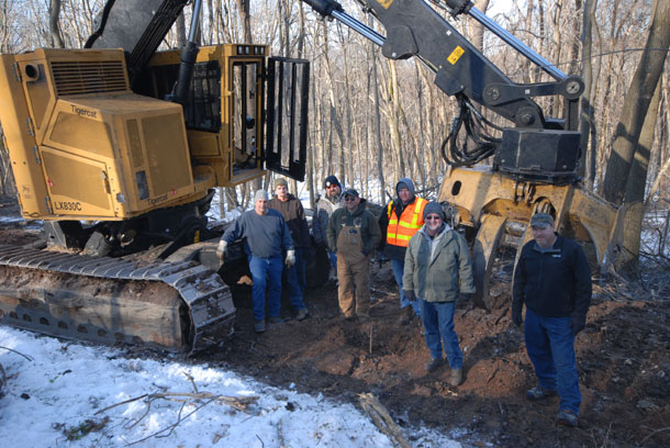 (L-R) J&B Logging owner and LX830C operator, Jimmy Glotfelty; skidder operator, Clayton Baker; Ricer Equipment (Tigercat dealership) owner, Lyle Ricer; Ricer Equipment sales specialist, Brandon Greene; Tigercat district manager, Jerry Smeak; sales specialist, Pat Garrett and mill owner from Indiana, Mike Reynolds