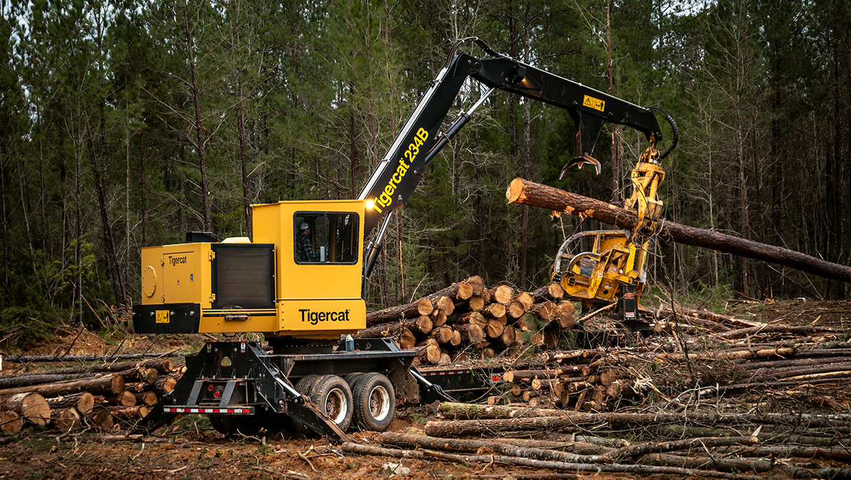 Tigercat 234B knuckleboom loader working in the field