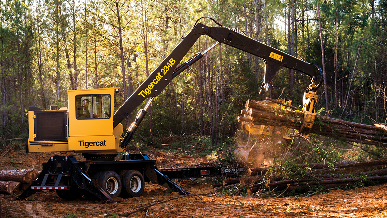 Tigercat 234B knuckleboom loader working in the field