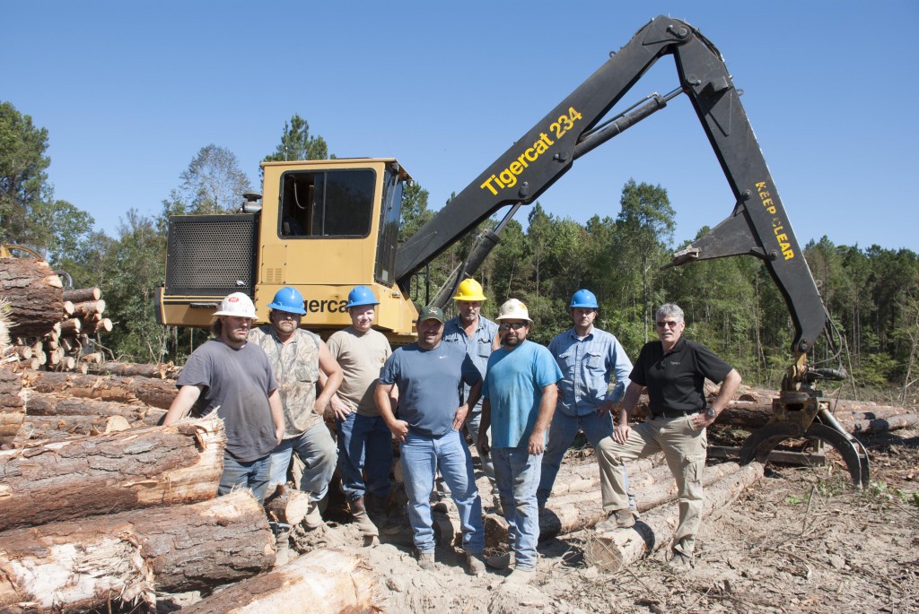 (L-R) Matt Wiggins, 630B operator; Mike Wiggins, 724G operator; Chad Huff, 630C operator; Ted Stroud, 234 operator; Michael Bedgood, owner; Jason Waters, foreman; Jason Norman, 234 operator; Heinz Pfeifer, Tigercat district manager.