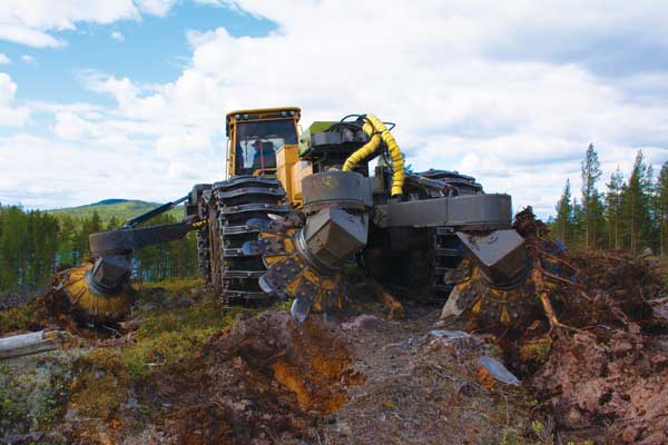 A Tigercat forwarder with a scarifying attachment on the front as well as two additional attachments on either size of the machine.