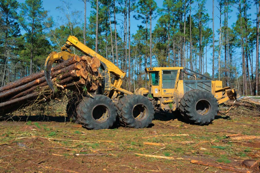 2014 Tigercat 635E skidder dragging a full load to the landing.