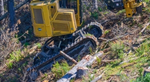 track machine climbing a steep hill