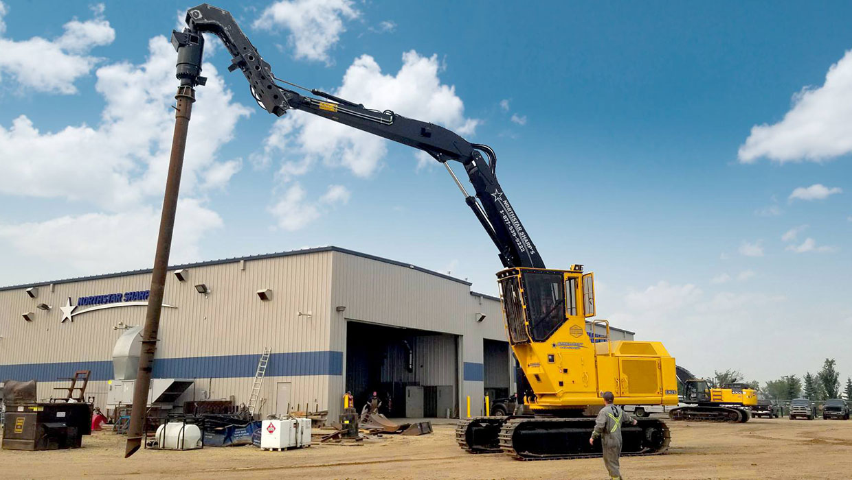 Image of a Tigercat 880 screw pile working in the field