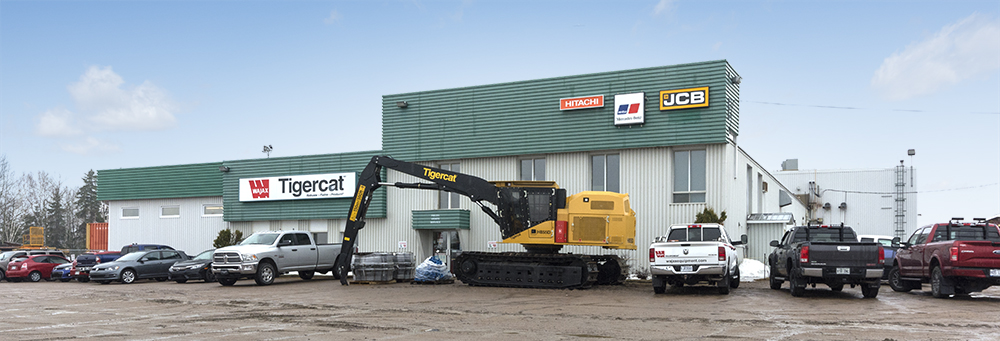 A Tigercat H855D sits in front of the Wajax building.