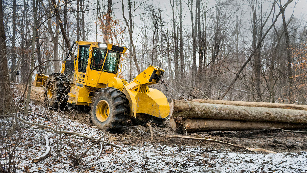 Tigercat 602 cable skidder working in the field