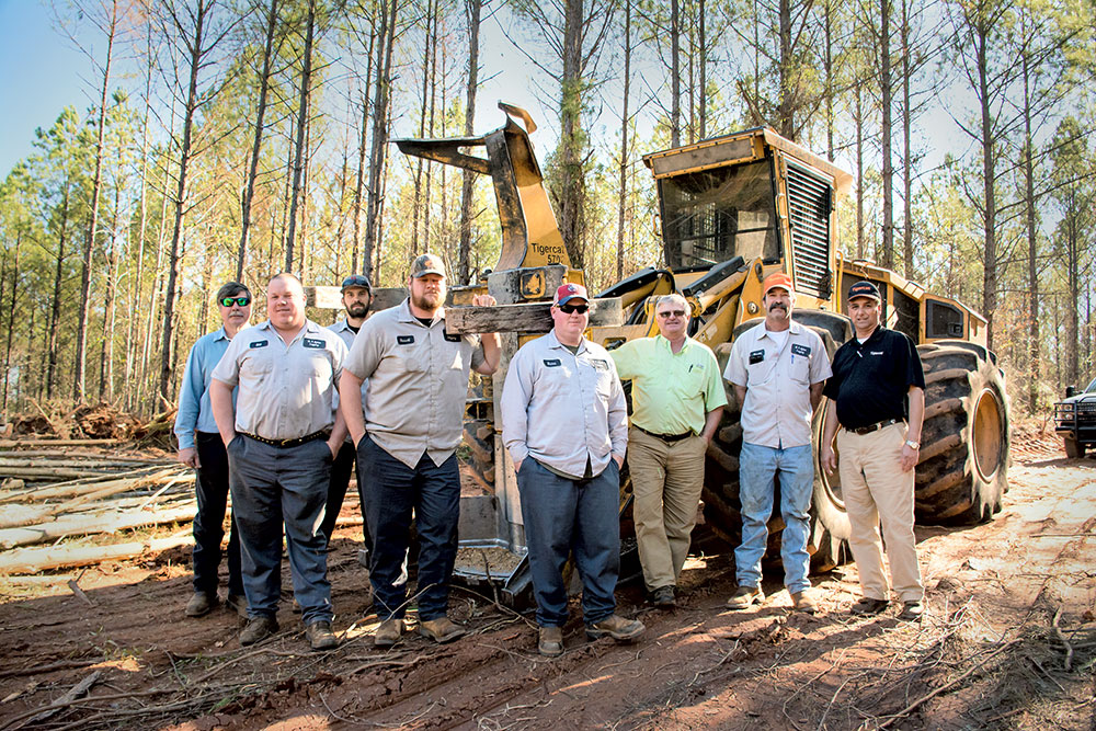 The thinning crew with Forestry 21 staff and Tigercat district manager Johnny Boyd. (L-R): Ricky McConnell, Edd Willingham, Zane Plair, Russell McCullers, Bubba Beckwith, Johnny Boyd, Marvin Sykes and Forestry 21 sales specialist Lewis Greer.