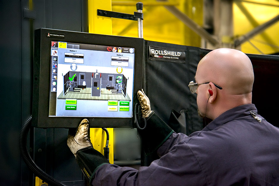 Robot operator Claus Frey checks the welder's progress.