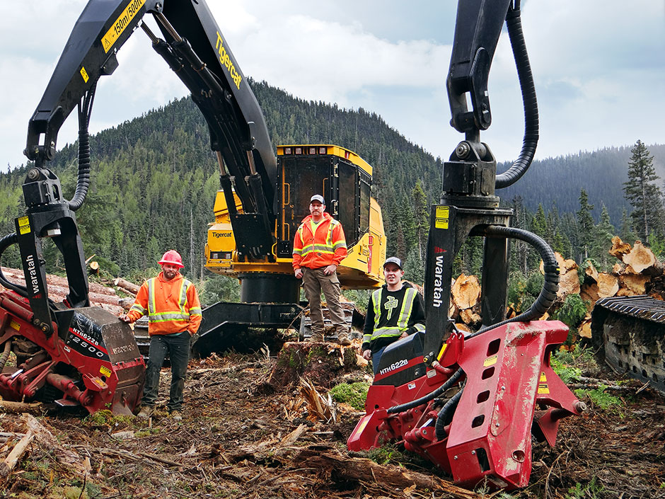 Ben Shortreed and Derek Lamothe stand with another operator with their new machine.