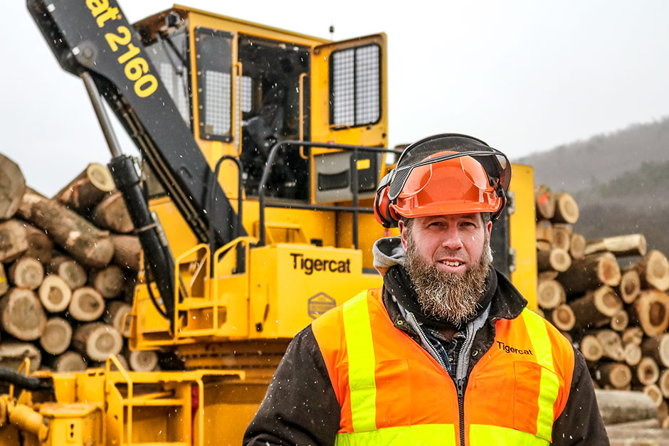 Leo Eby, co-owner of Eby’s Sawmill in front of his new Tigercat 2160 loader forwarder. 