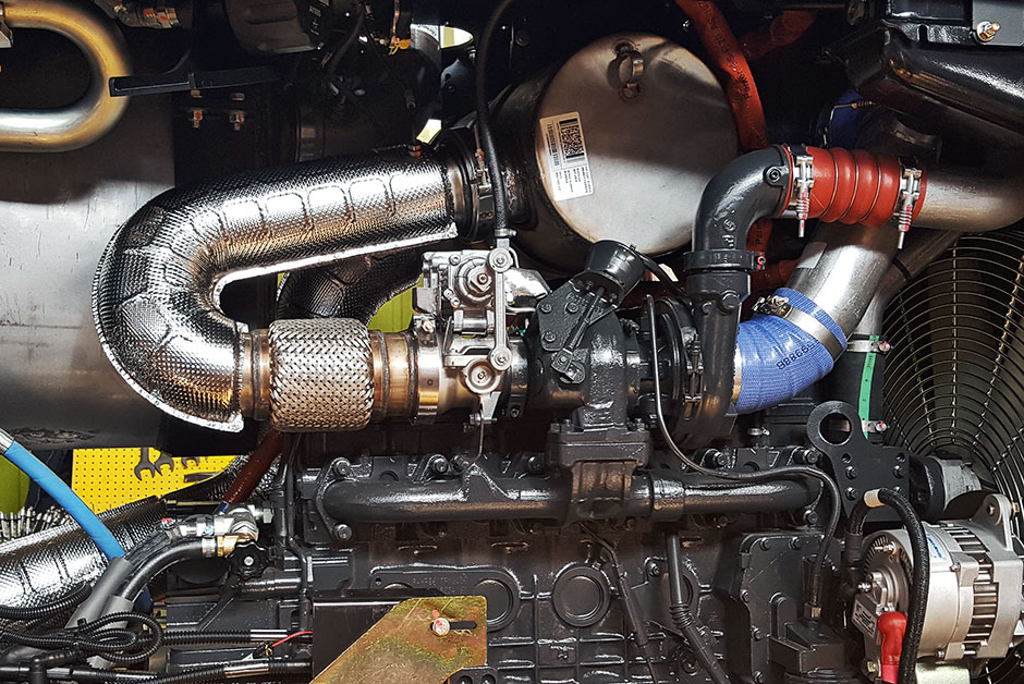 Turbocharger system installed on a Tigercat ftimber harvesting machine