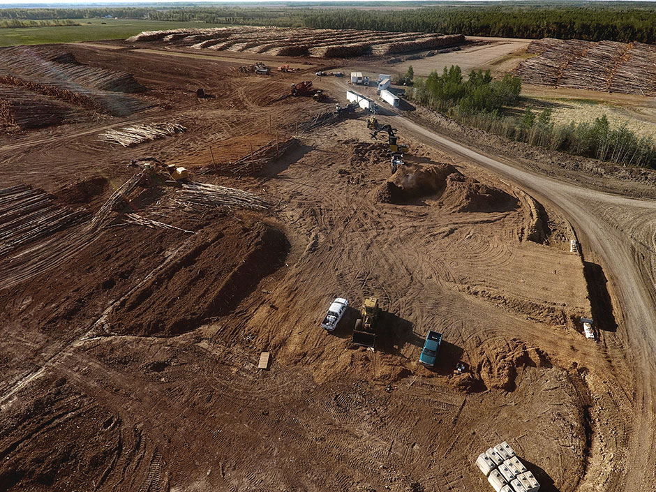 A birds eye view of Peace River Loggings chipping yard. 