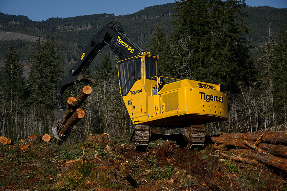 Tigercat 890 log loader shovel logging mountainside in British Columbia 