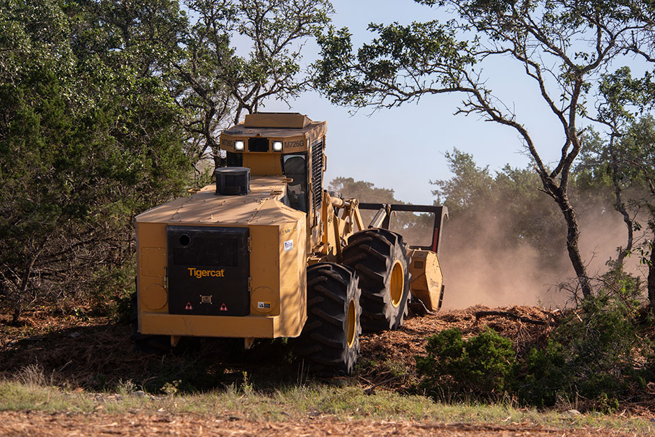 Tigercat M726G mulching machine makes it's way uphill.