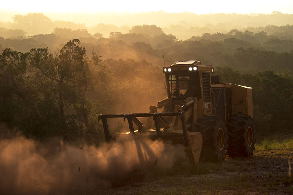 The Tigercat M726G mulcher with 4061 mulching head operating early morning in Hill Country, Texas. 