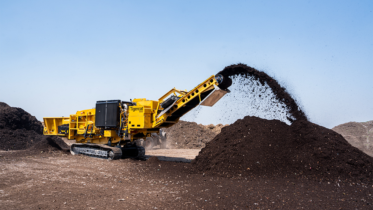 Image of a 6900 grinder working in the field.