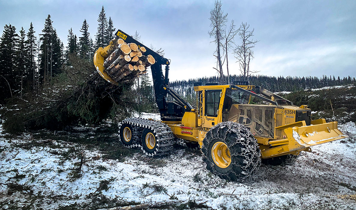 Image of a Tigercat 635H swing boom skidder working in the field