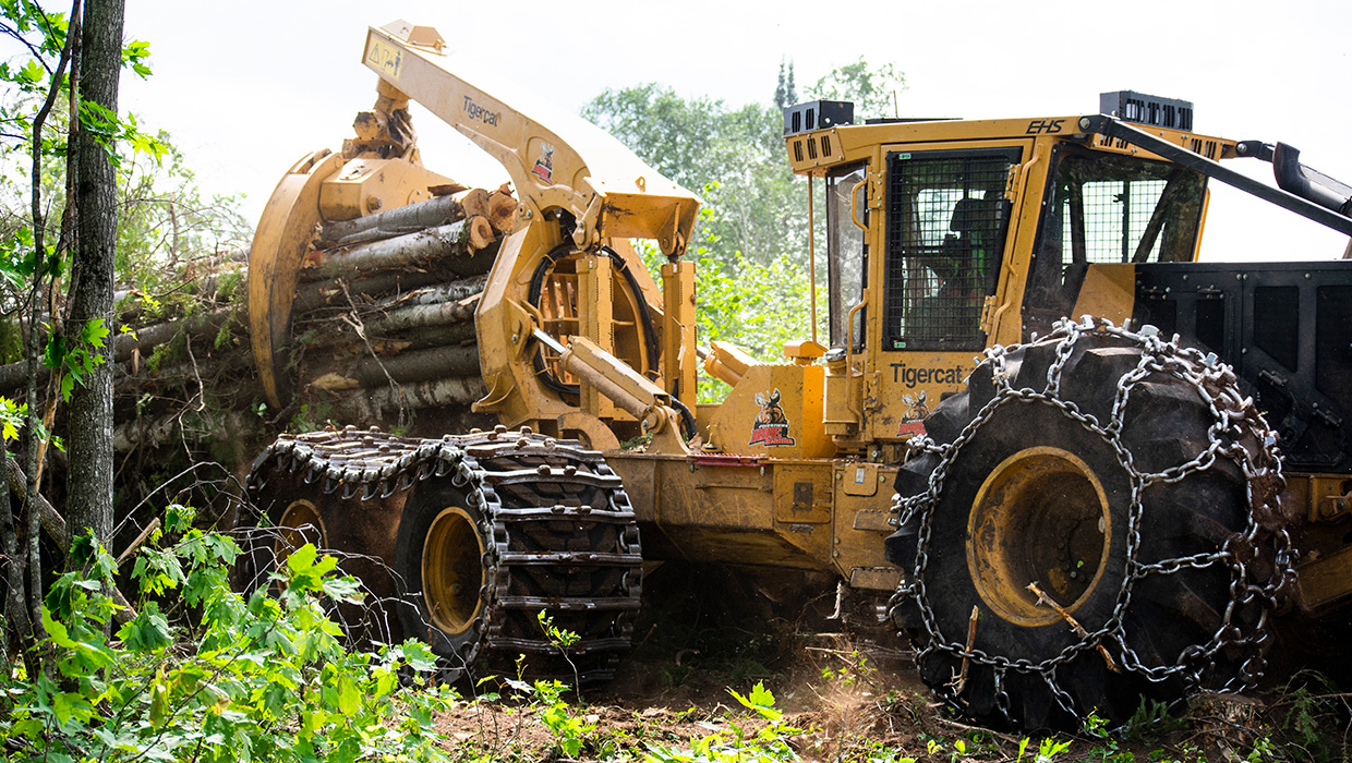 635H skidder moving wood