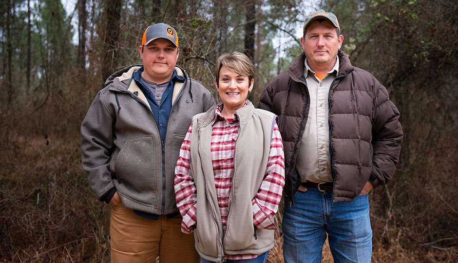 Jimmie McKinney with his son Justin and wife Tina.