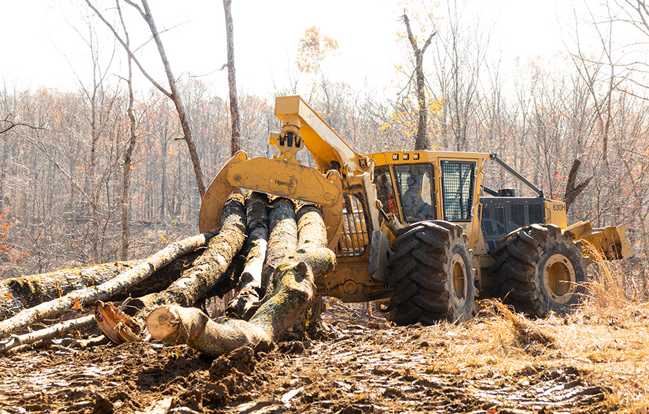 The skidder operators pull one or two trees at a time out of the steeper parts of the tract and then build large bunches for the half mile plus runs to the landing.