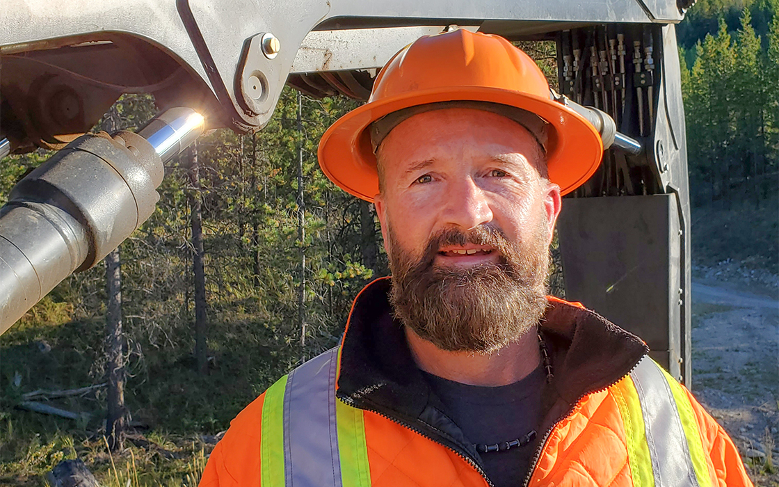 a District Manager Between the Branches Tigercat TCi