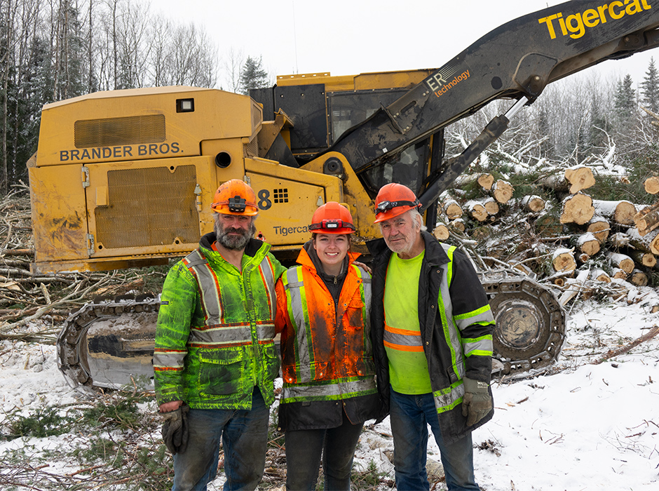 Three loggers in front of a processor.