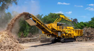 A Tigercat 6900 grinder working in the field
