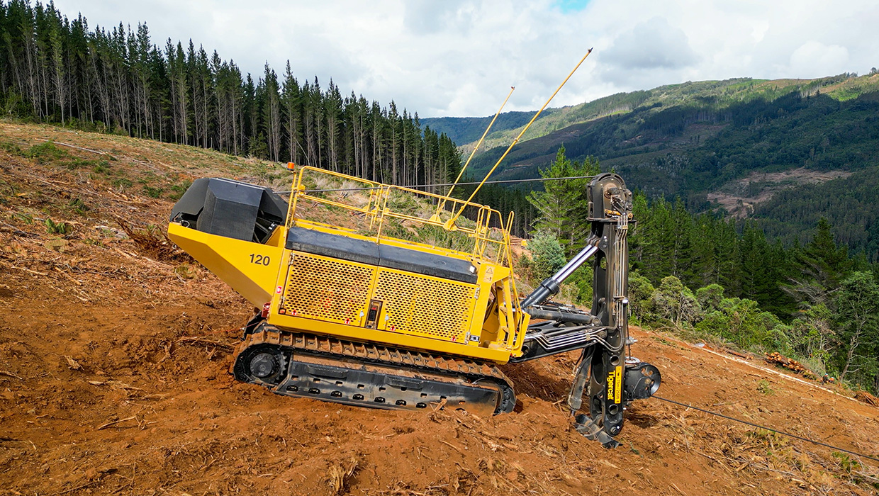 Image of a Tigercat 120 winch assist working in the field