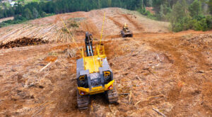 Tigercat 120 winch assist working in the field