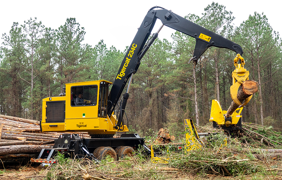 234C loader delimbing a tree