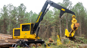 234C loader delimbing a tree
