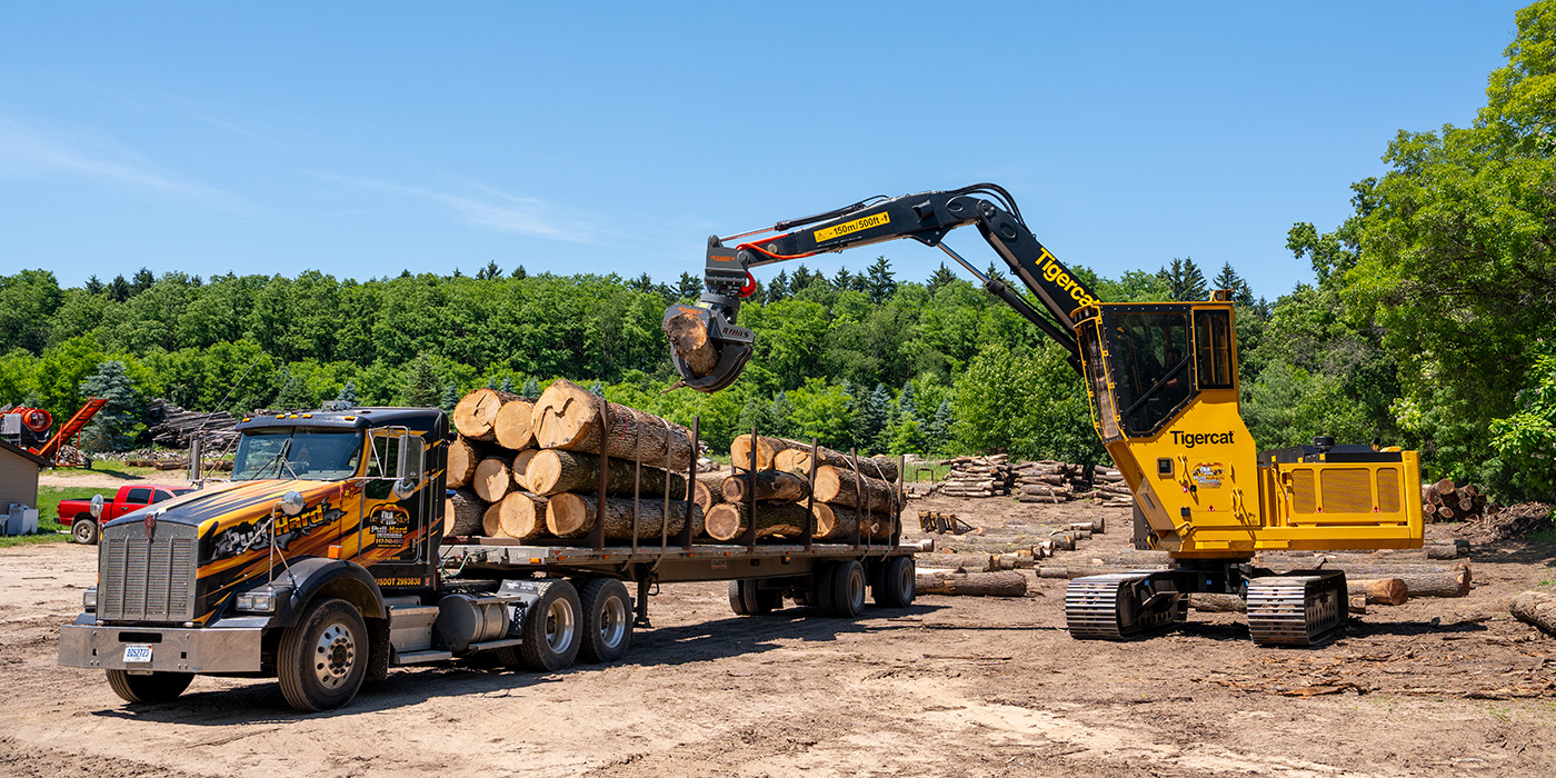 Tigercat 865 logger in wood yard