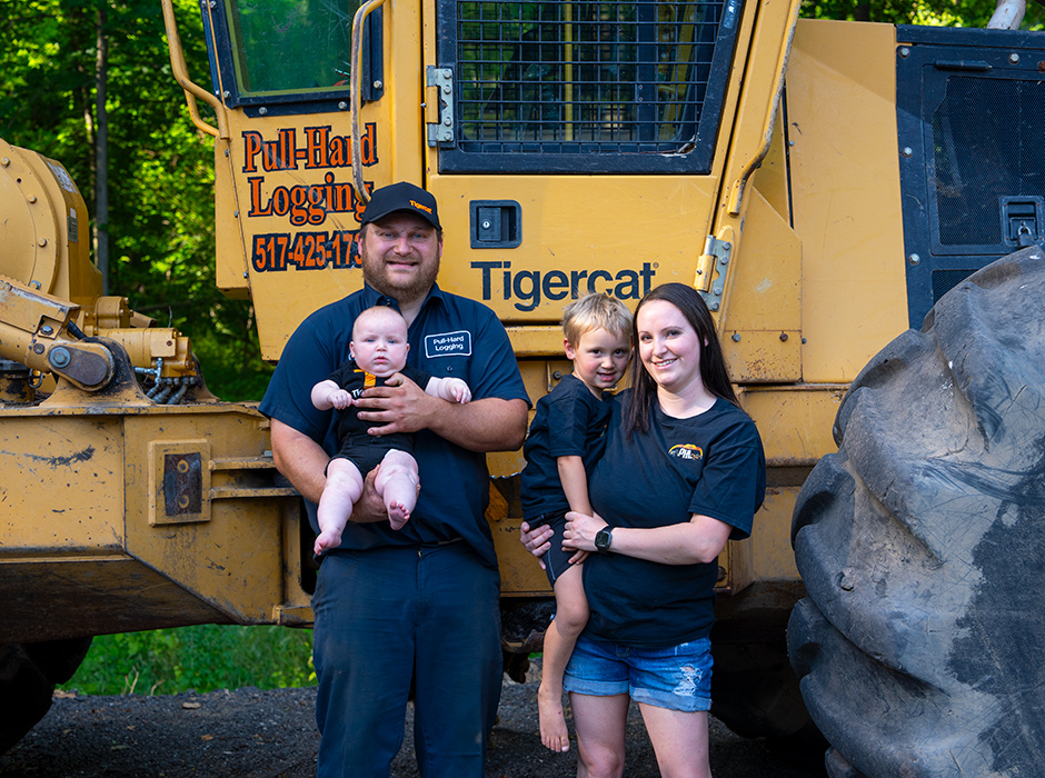 Colton Fodor, his wife Alexandra, and their two children, who may be the fourth generation of Fodor loggers.