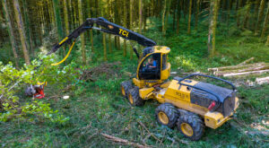 A TCi 1165 harvester working in the field