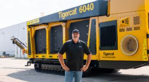 Tigercat product engineer in front of a 6040 carbonizer