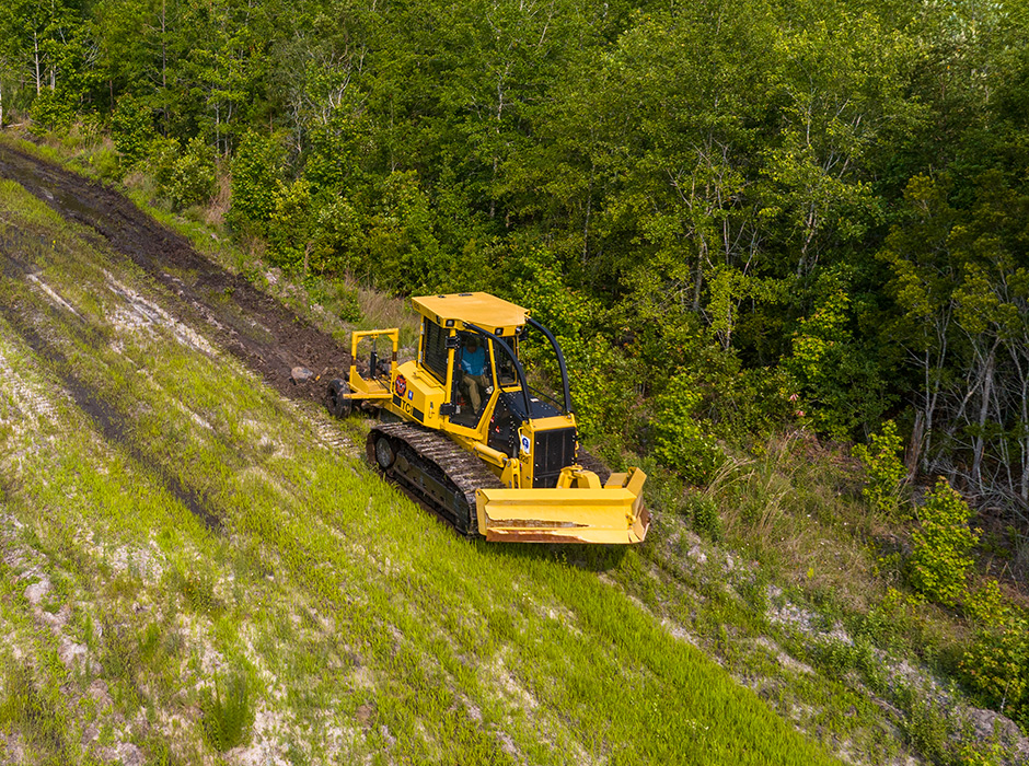 Chris makes a first pass on a perimeter firebreak with the plow engaged.