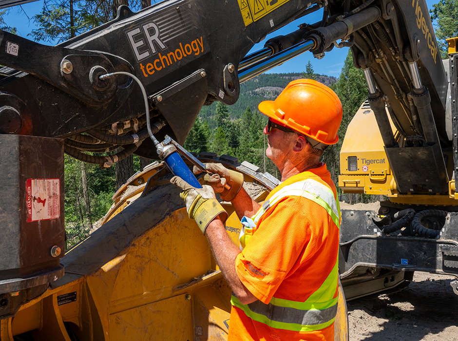 Mike Miller greasing LX877 boom