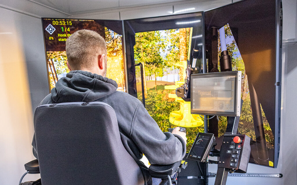 Student running Tigercat logging equipment simulator