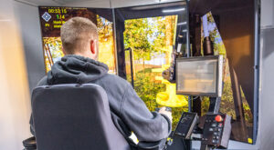Student running Tigercat logging equipment simulator