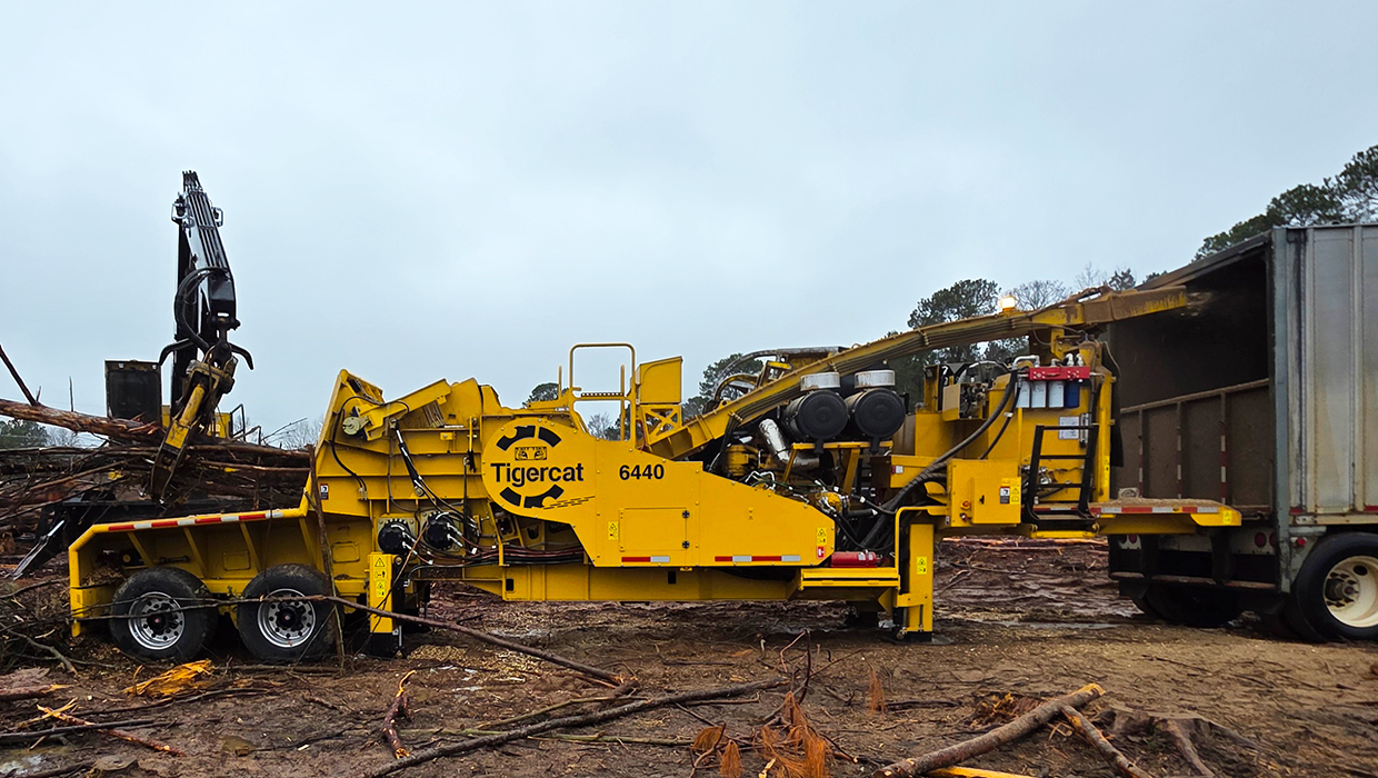 Image of a Tigercat 6440 chipper working in the field.