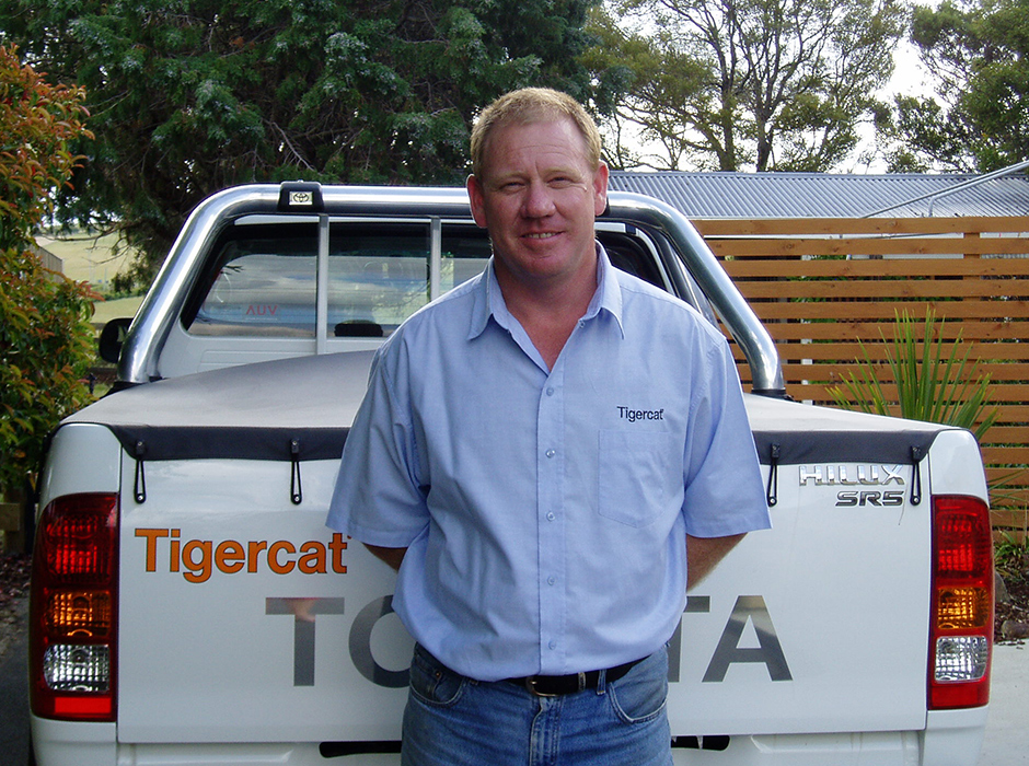 Photo of Steve Green in front of a Tigercat truck